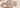 Round diamond engagement ring shown in a close-up view on a soft neutral background. 